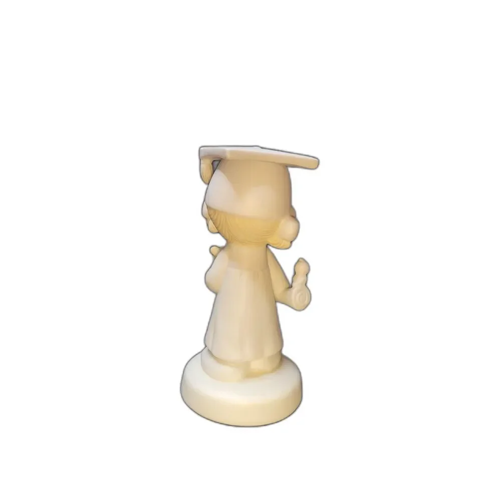 Precious Moments graduation figurine